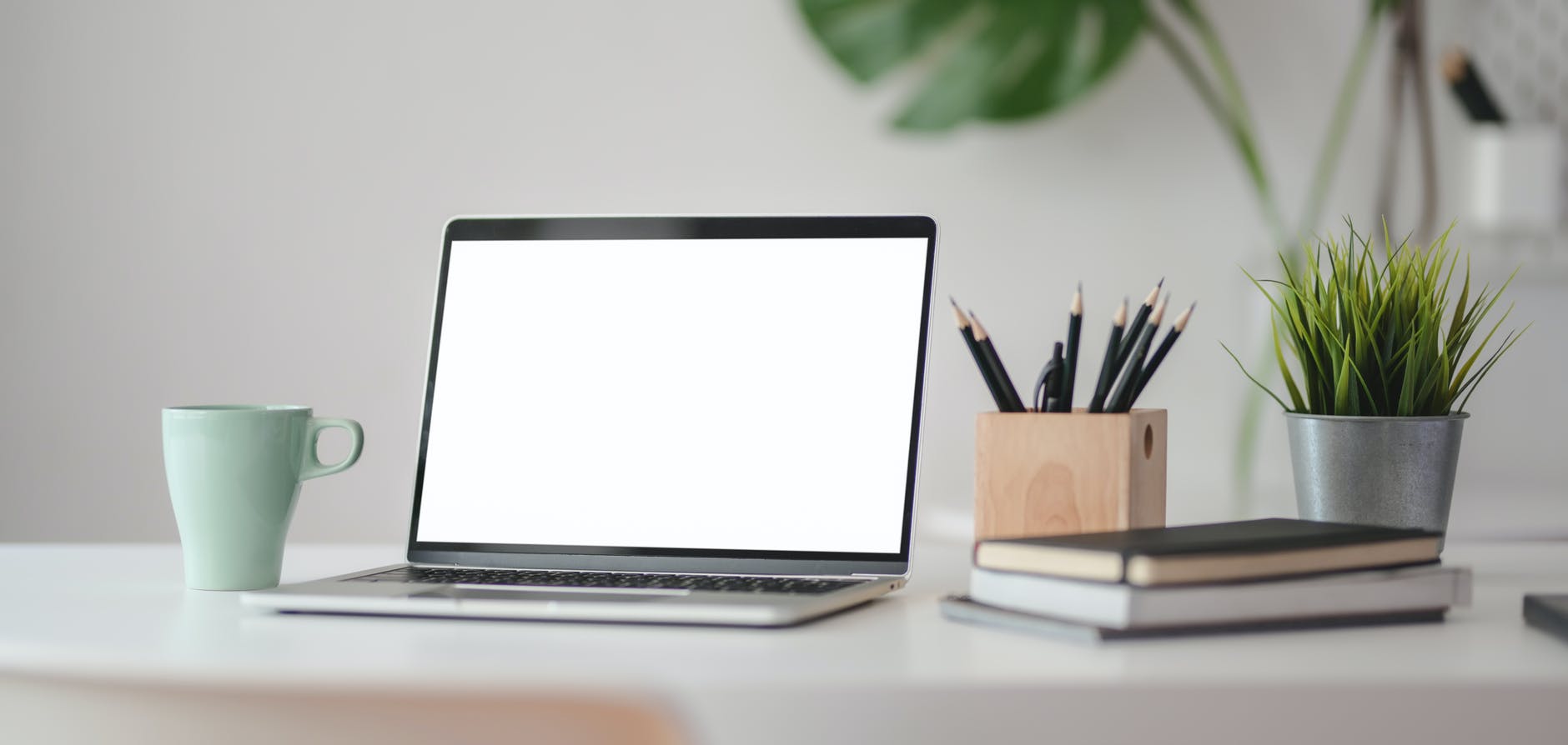 macbook pro on white table